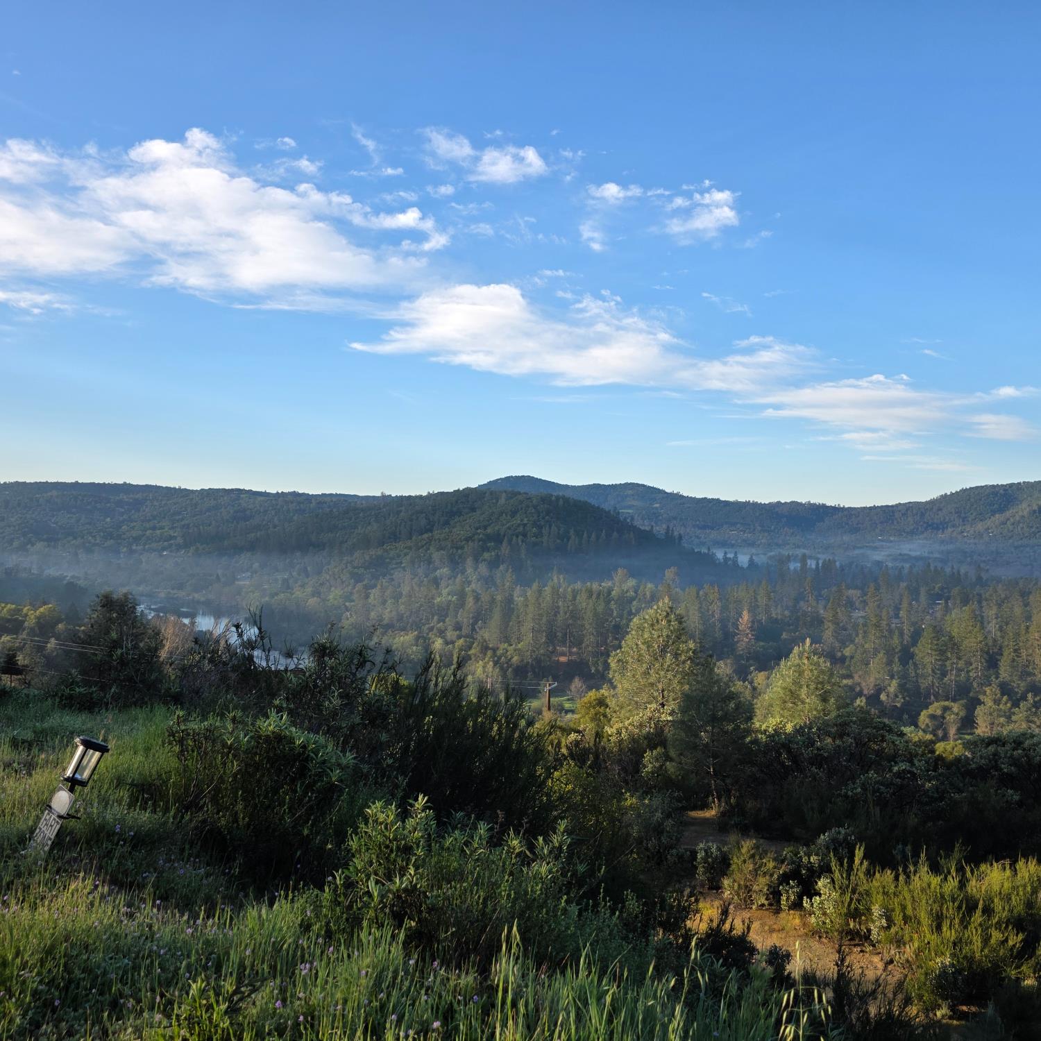 6600 Marshall Road Lotus, CA 95651 - Photo 17 of 32 a view of a lake with mountains in the background