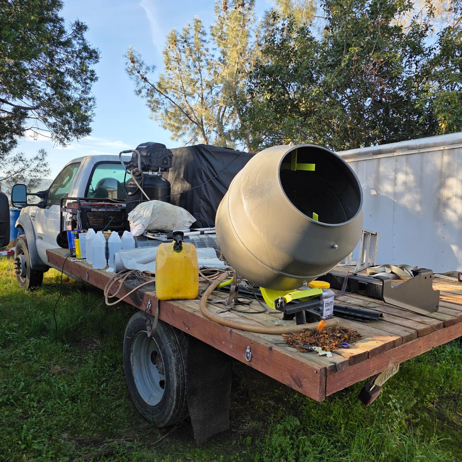 6600 Marshall Road Lotus, CA 95651 - Photo 32 of 32 a roof deck with table and chairs with potted plants and large trees