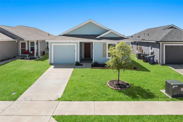 a house with garden in front of it