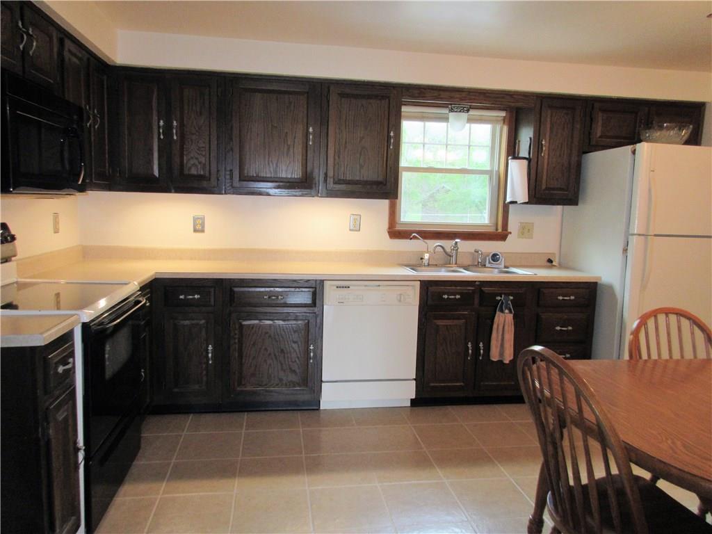 244 Harbison Road Sarver, PA 16055 - Photo 9 of 25 Kitchen has ceramic tile floors. The room connects to dining room, entry, and family room.