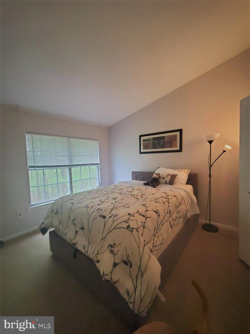 1479 Casino Circle Silver Spring, MD 20906 - Photo 13 of 24 a bedroom with a bed and window