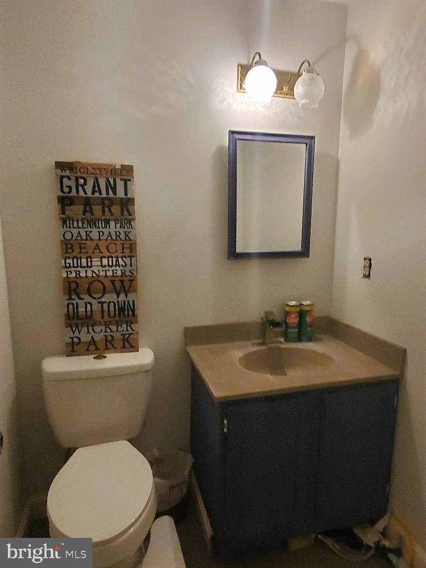 1479 Casino Circle Silver Spring, MD 20906 - Photo 18 of 24 a bathroom with a toilet sink and mirror