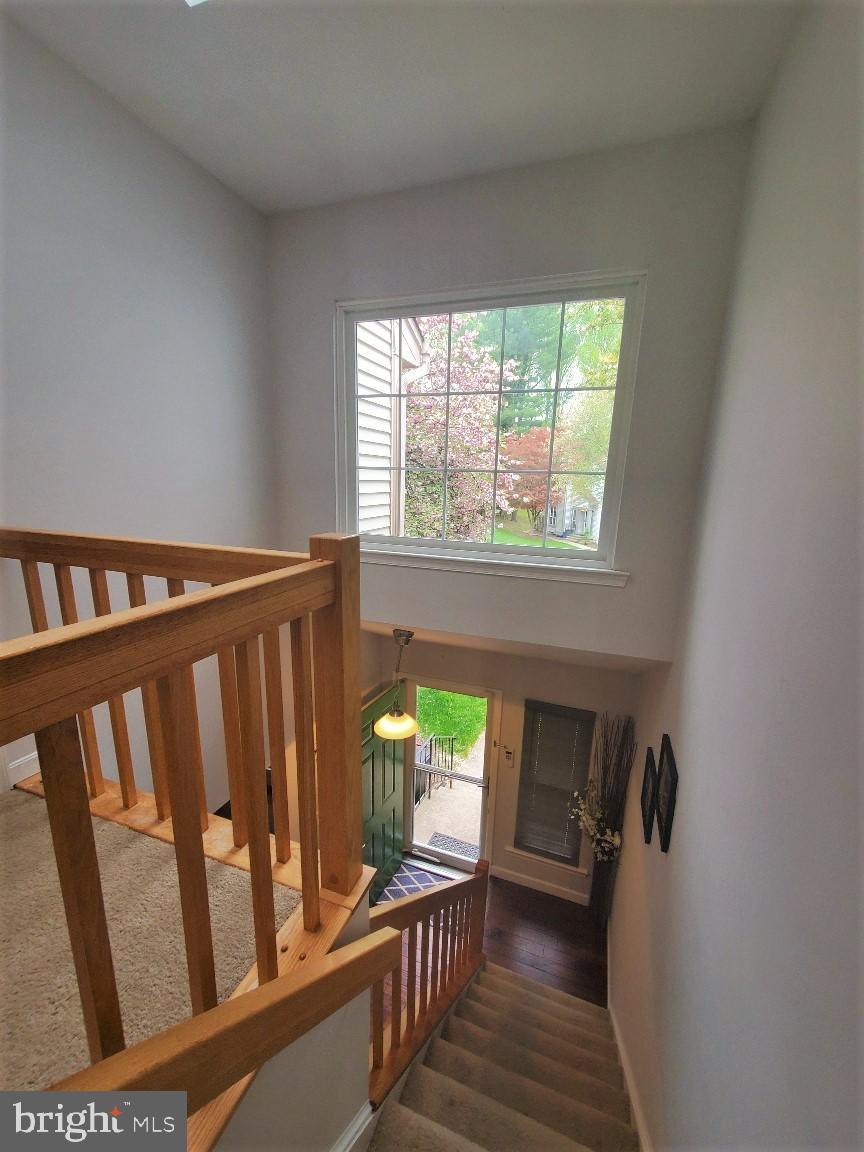 1479 Casino Circle Silver Spring, MD 20906 - Photo 21 of 24 a view of a hallway and wooden floor stairs