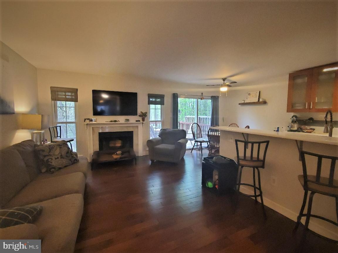1479 Casino Circle Silver Spring, MD 20906 - Photo 10 of 24 a living room with furniture a fireplace and a flat screen tv