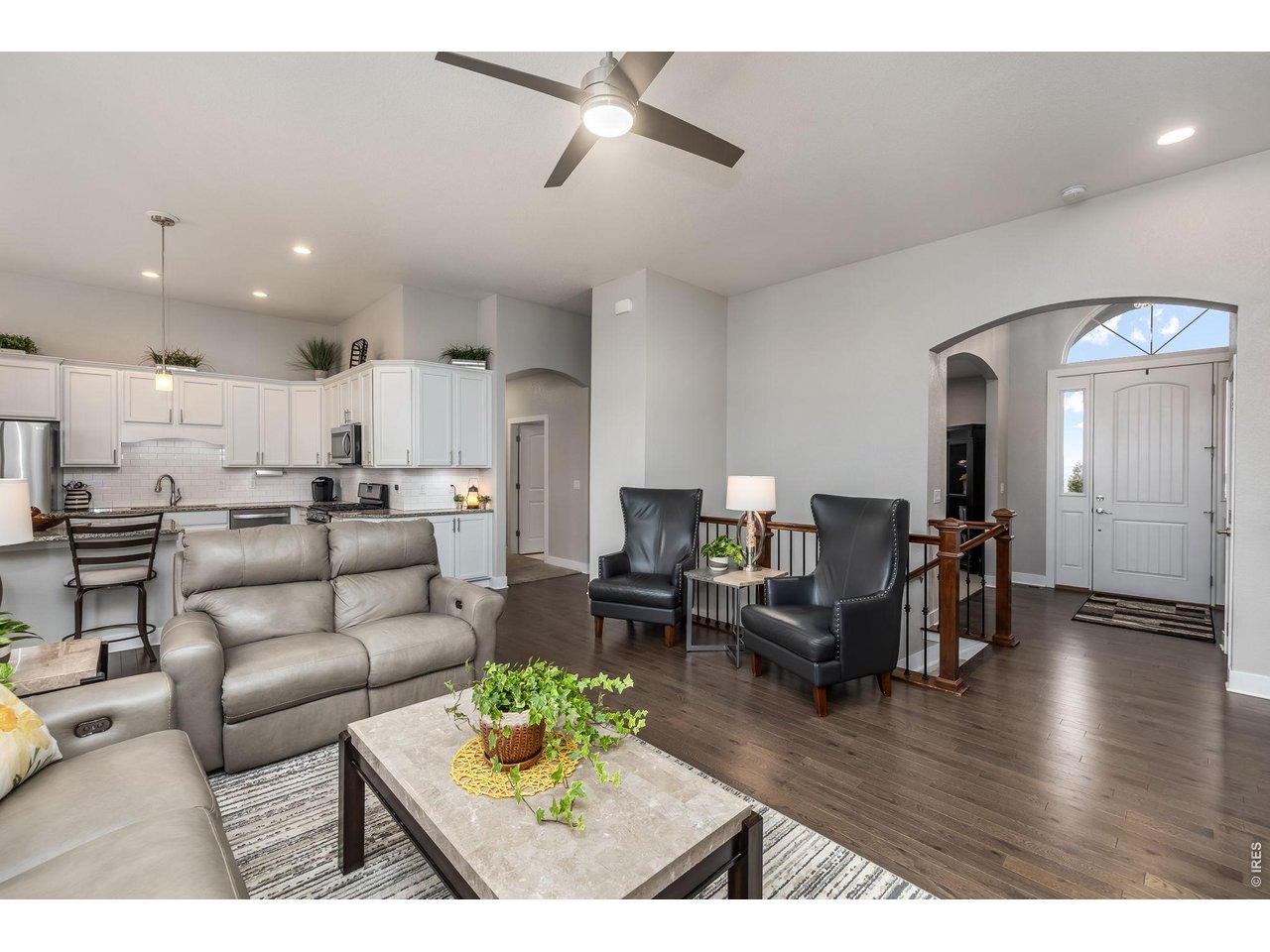 3789 Bridle Ridge Circle Severance, CO 80524 - Photo 6 of 44 a living room with furniture and kitchen view