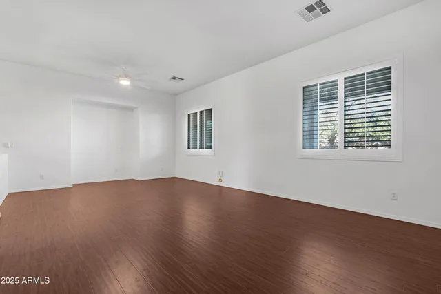 a kitchen with stainless steel appliances granite countertop a sink and a white cabinets