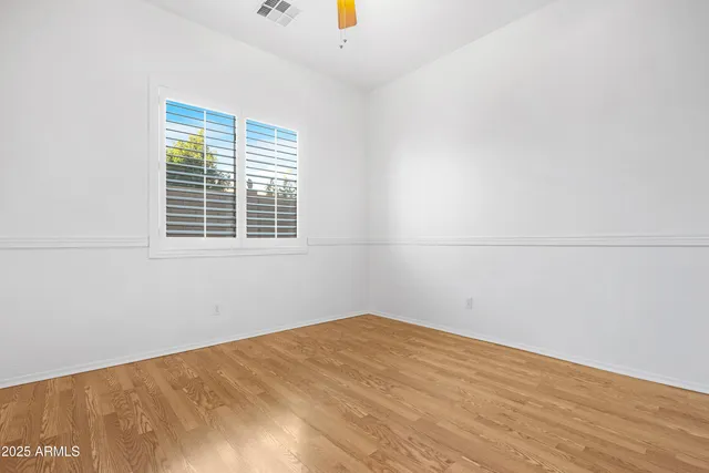 a bathroom with a granite countertop sink two mirror and a