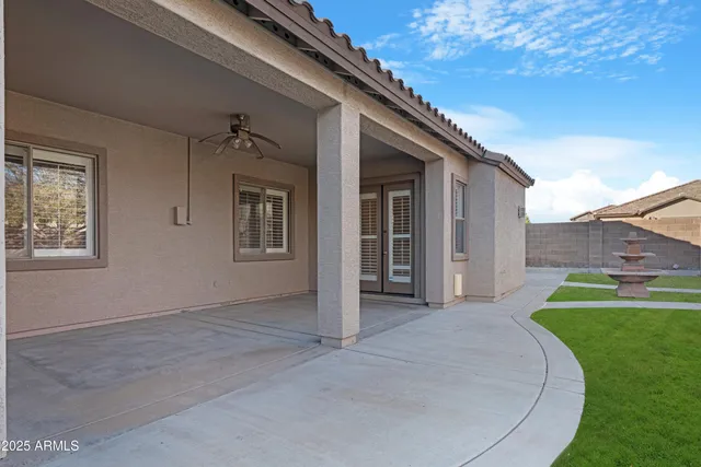 a view of a house with a backyard