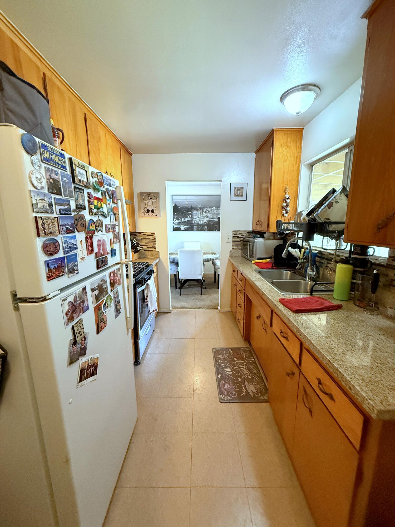 50 East Portal Street Oak View, CA 93022 - Photo 25 of 33 a kitchen with stainless steel appliances granite countertop a sink and cabinets