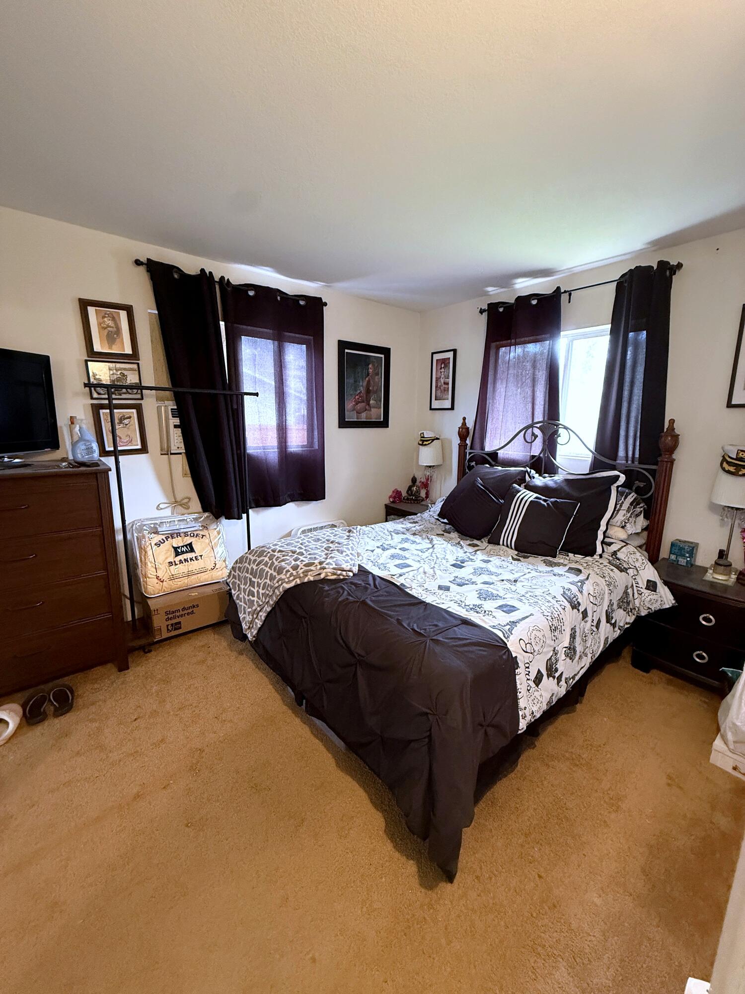 50 East Portal Street Oak View, CA 93022 - Photo 26 of 33 a bedroom with a bed window and a television