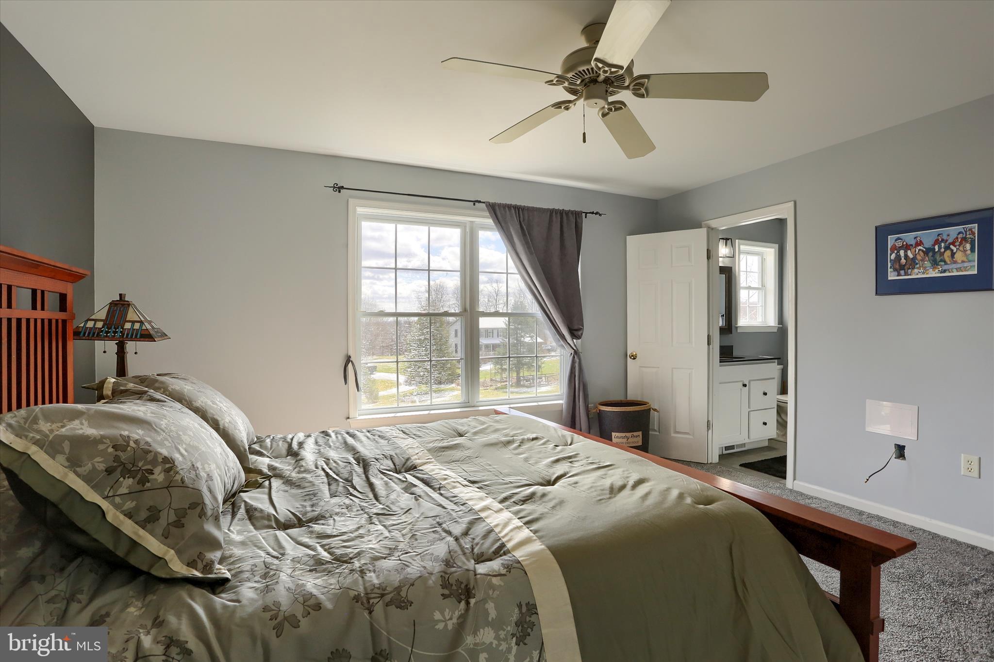 440 Whisler Road Etters, PA 17319 - Photo 22 of 33 a bedroom with a bed and a chandelier