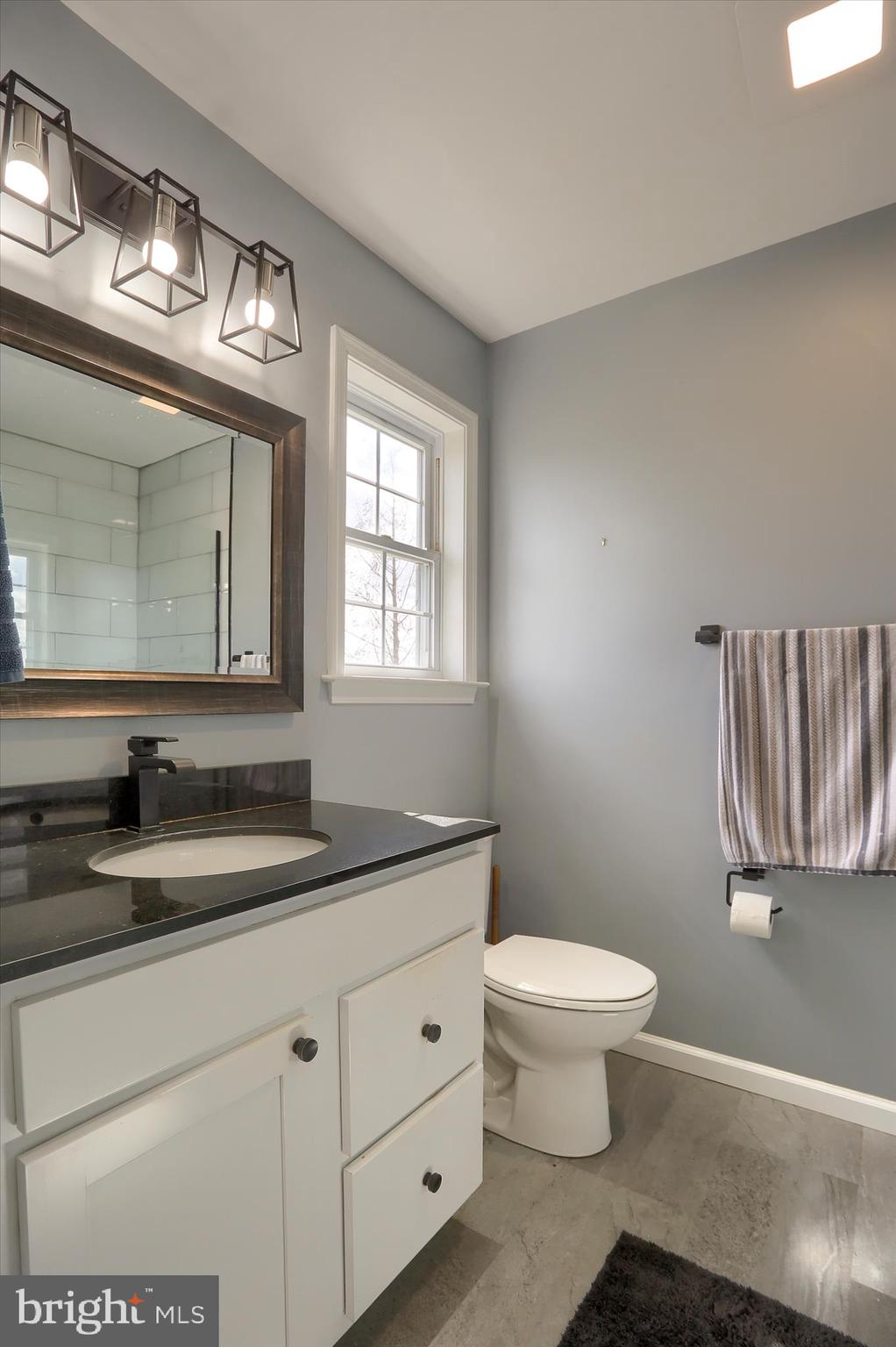 440 Whisler Road Etters, PA 17319 - Photo 24 of 33 a bathroom with a granite countertop sink a toilet and a mirror