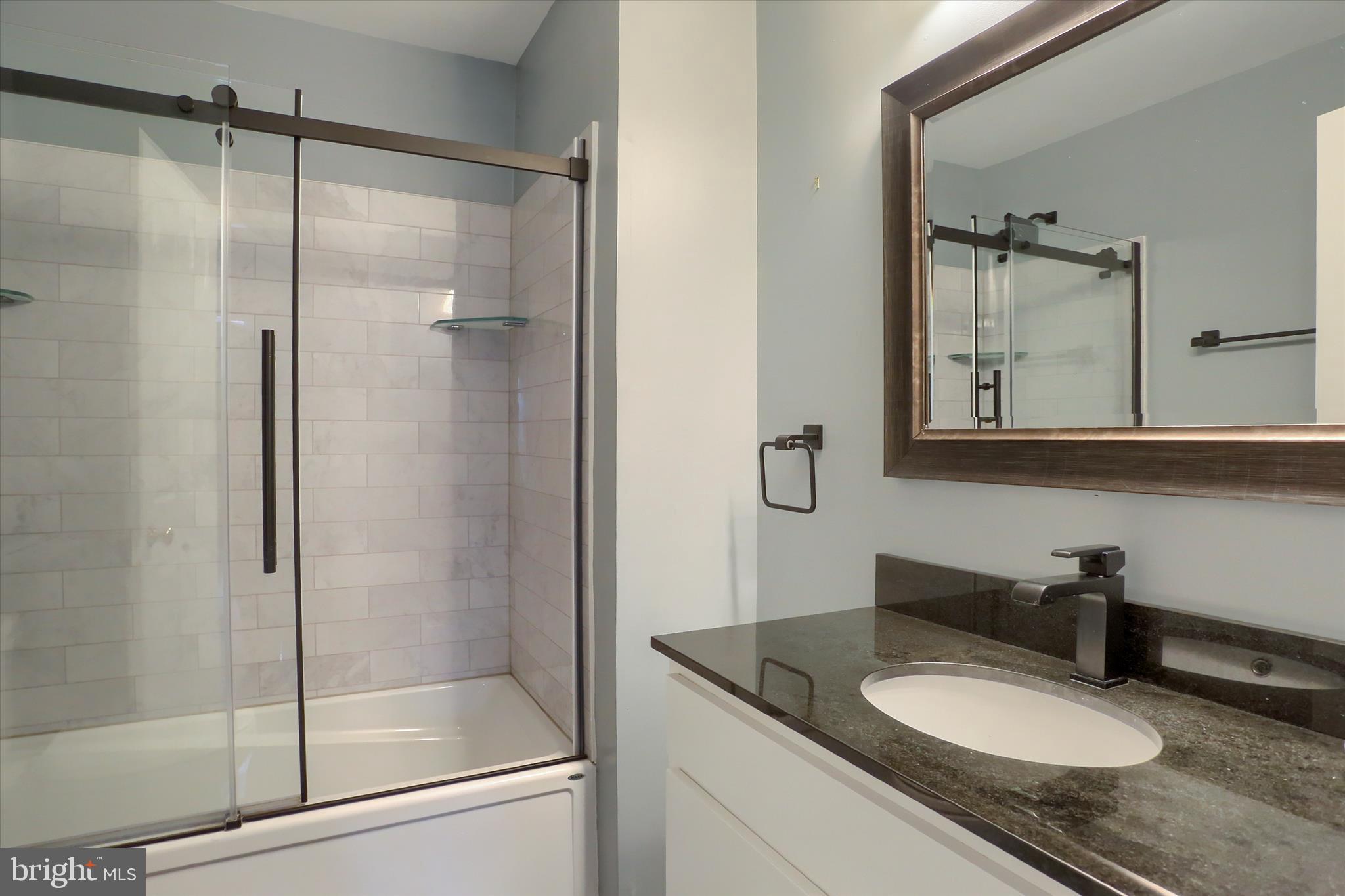 440 Whisler Road Etters, PA 17319 - Photo 26 of 33 a bathroom with a granite countertop sink mirror and shower
