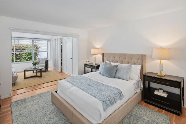 a bedroom with a bed and a couch