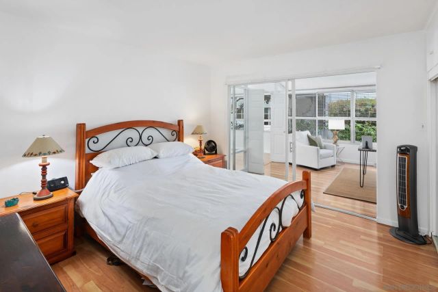 a bed room with a bed and a chair