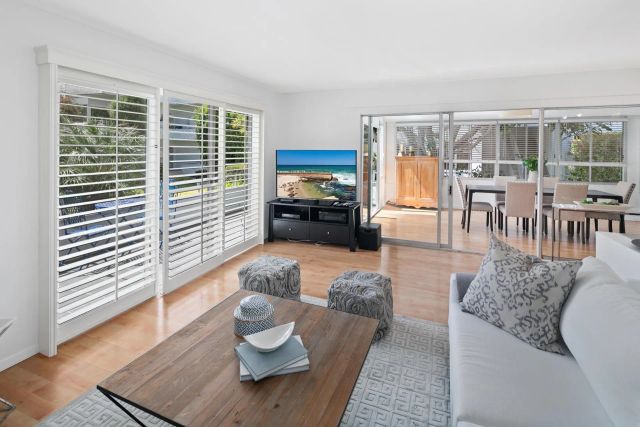 a living room with furniture and a window