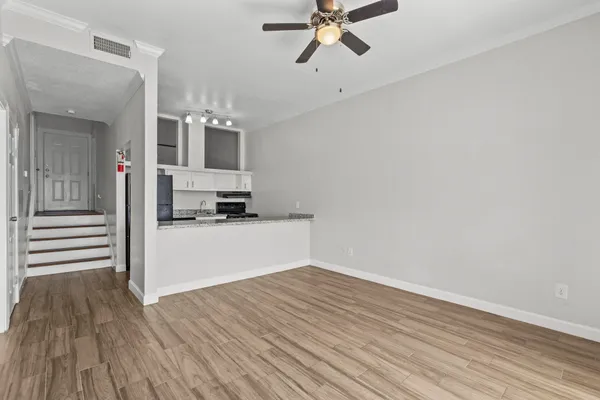 a view of a kitchen from the hallway