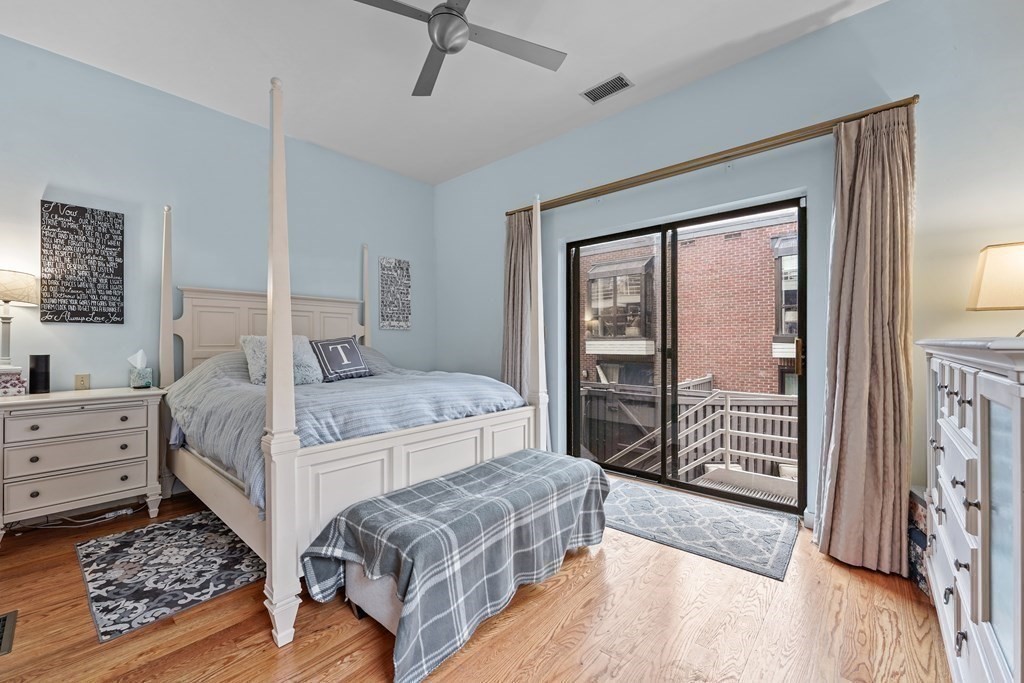 6 Shipway Place, Unit 6 Boston, MA 02129 - Photo 12 of 25 a bedroom with a bed and a window