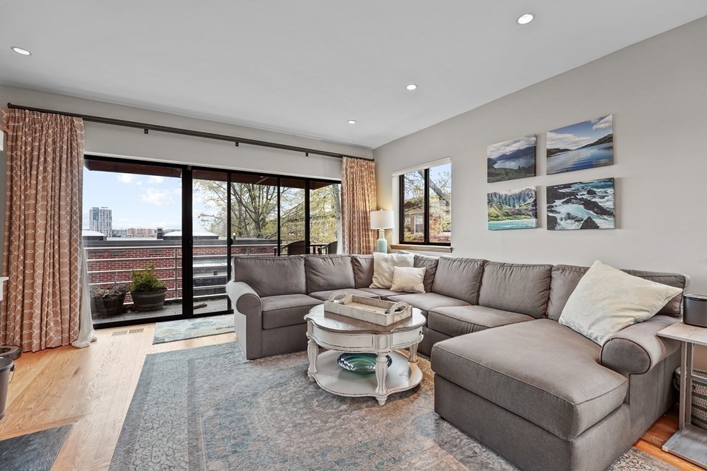 6 Shipway Place, Unit 6 Boston, MA 02129 - Photo 2 of 25 a living room with furniture and a large window