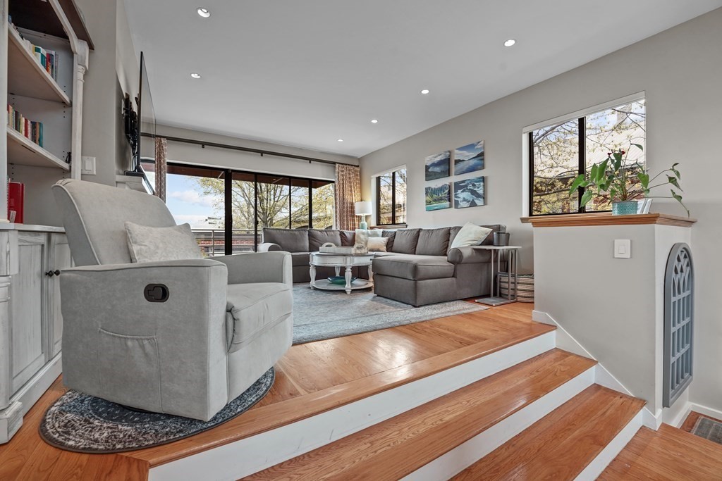 6 Shipway Place, Unit 6 Boston, MA 02129 - Photo 3 of 25 a living room with furniture and a large window