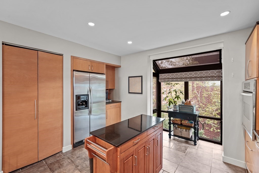6 Shipway Place, Unit 6 Boston, MA 02129 - Photo 9 of 25 a kitchen with granite countertop a refrigerator and a sink
