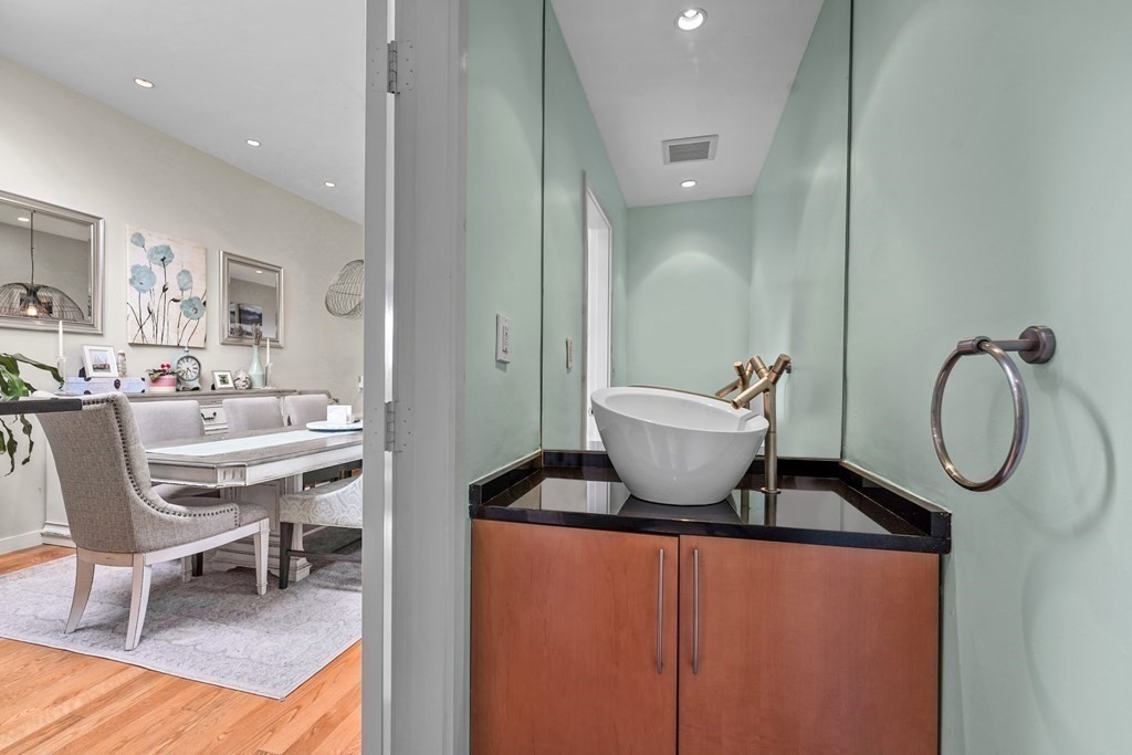 6 Shipway Place, Unit 6 Boston, MA 02129 - Photo 10 of 25 a living room with furniture a window and gym equipment