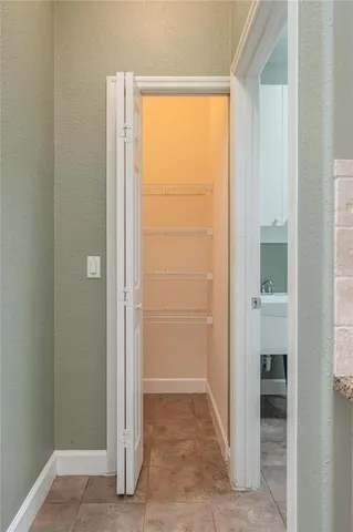 an empty room with wooden floor and a window