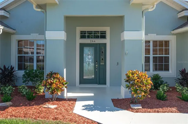a view of a street with cars parked on the road