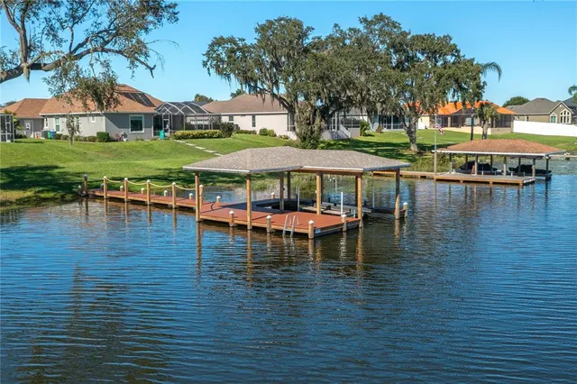 an aerial view of a houses with ocean view