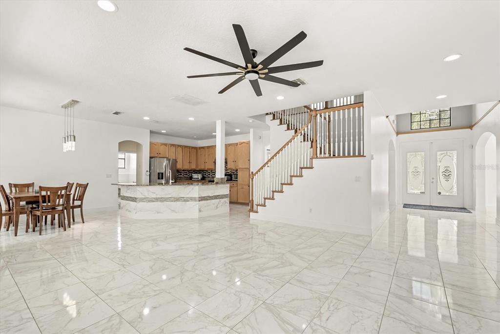 871 Blairmont Lane Lake Mary, FL 32746 - Photo 11 of 56 a view of a livingroom with furniture and a ceiling fan