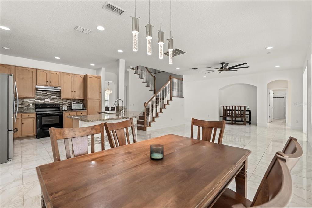 871 Blairmont Lane Lake Mary, FL 32746 - Photo 14 of 56 a view of a dining room with furniture