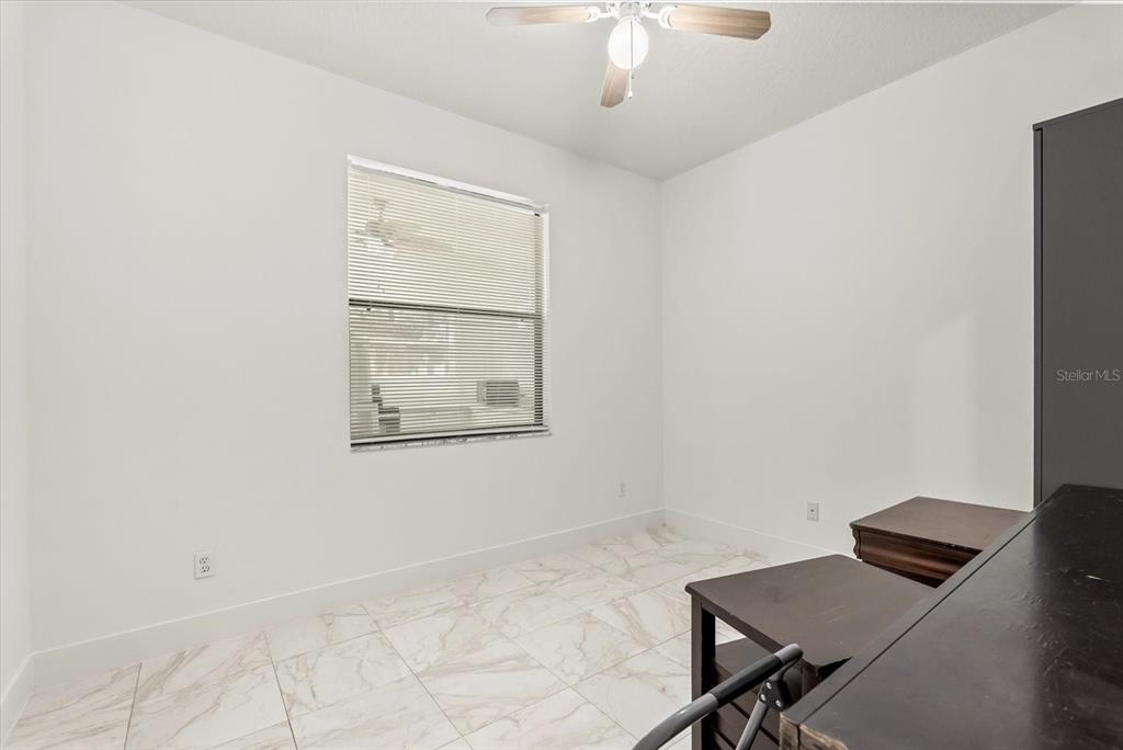 871 Blairmont Lane Lake Mary, FL 32746 - Photo 18 of 56 a view of a workspace with furniture and a window