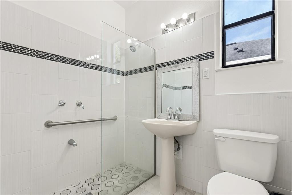 871 Blairmont Lane Lake Mary, FL 32746 - Photo 20 of 56 a bathroom with a toilet a sink and shower