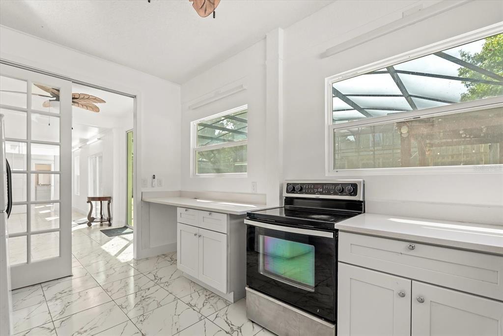 871 Blairmont Lane Lake Mary, FL 32746 - Photo 25 of 56 a kitchen with a stove a sink and a refrigerator