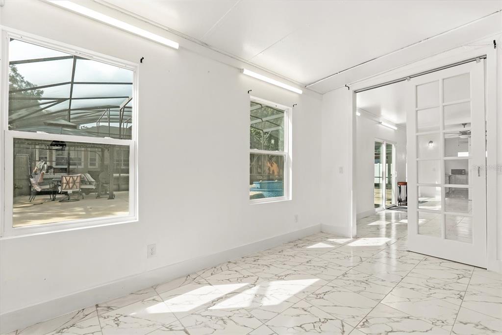 871 Blairmont Lane Lake Mary, FL 32746 - Photo 28 of 56 a view of a livingroom with wooden floor and a window