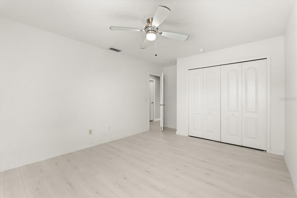 871 Blairmont Lane Lake Mary, FL 32746 - Photo 32 of 56 an empty room with a ceiling fan and a window