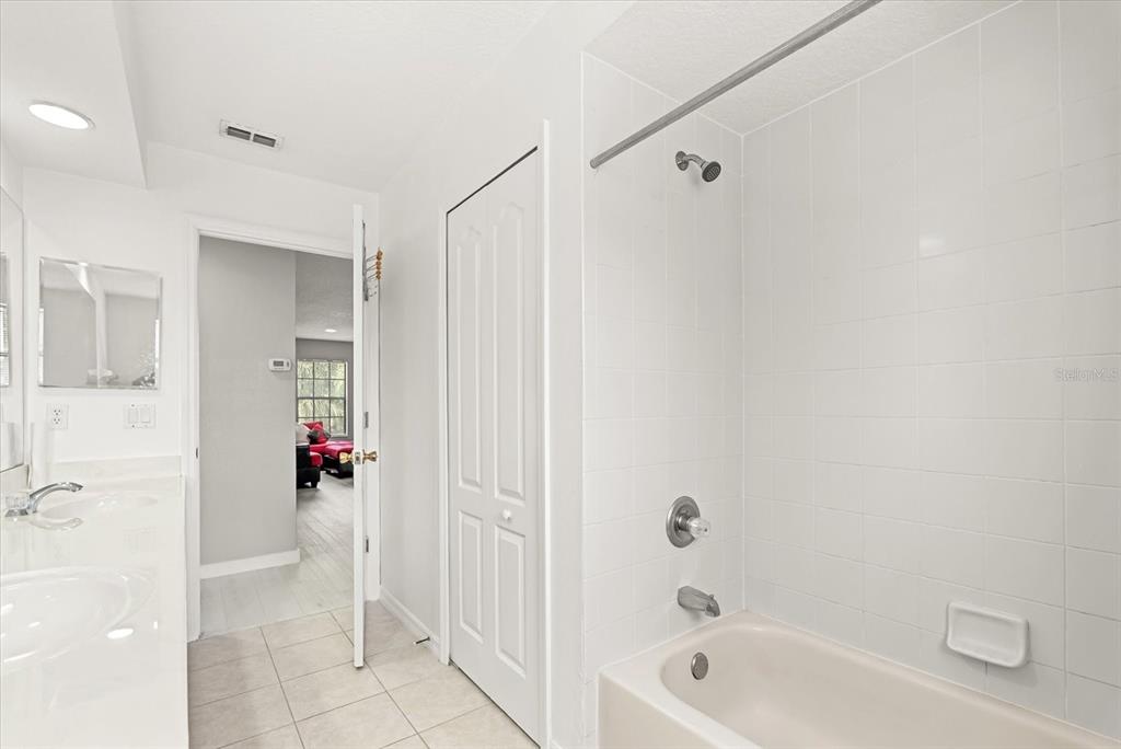 871 Blairmont Lane Lake Mary, FL 32746 - Photo 35 of 56 a bathroom with a bathtub and a shower