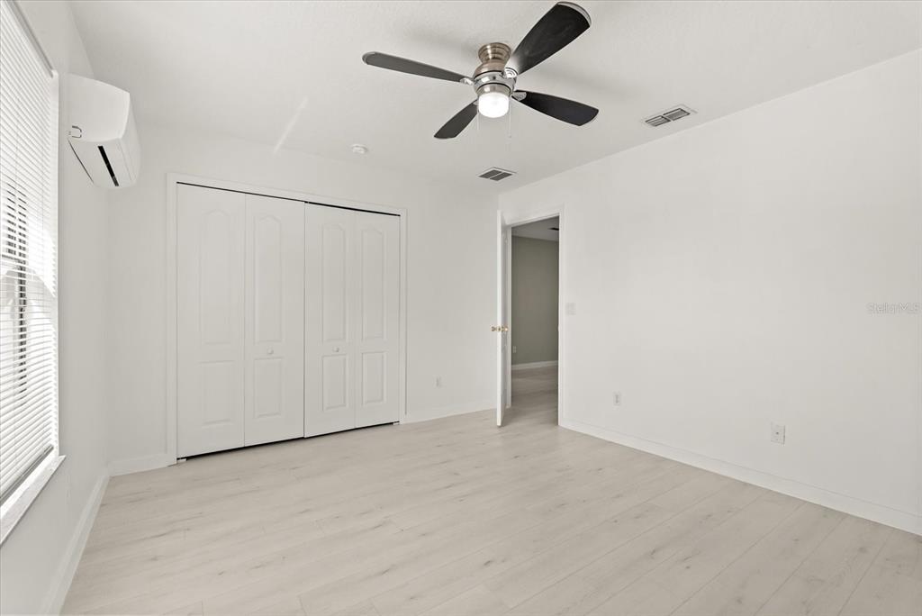 871 Blairmont Lane Lake Mary, FL 32746 - Photo 37 of 56 an empty room with a ceiling fan and a window