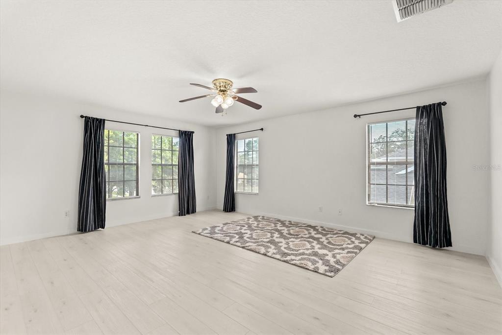 871 Blairmont Lane Lake Mary, FL 32746 - Photo 38 of 56 a bedroom with a large bed and a window