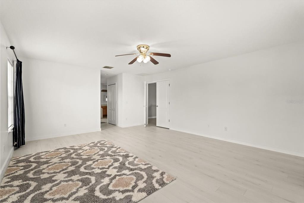 871 Blairmont Lane Lake Mary, FL 32746 - Photo 39 of 56 a view of a bedroom with a ceiling fan