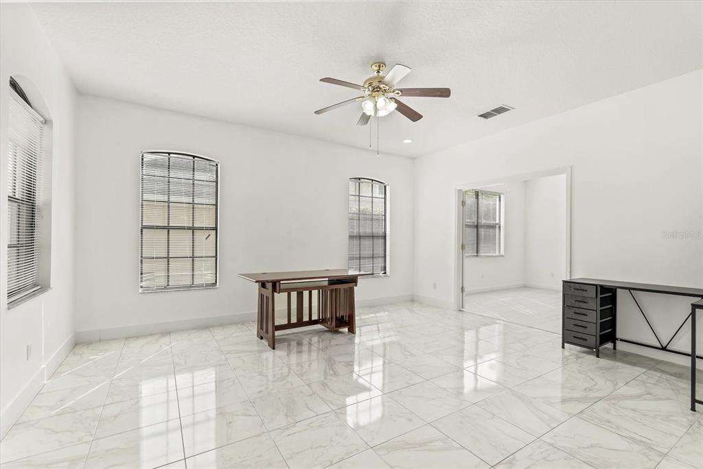 871 Blairmont Lane Lake Mary, FL 32746 - Photo 5 of 56 a view of an empty room with a window