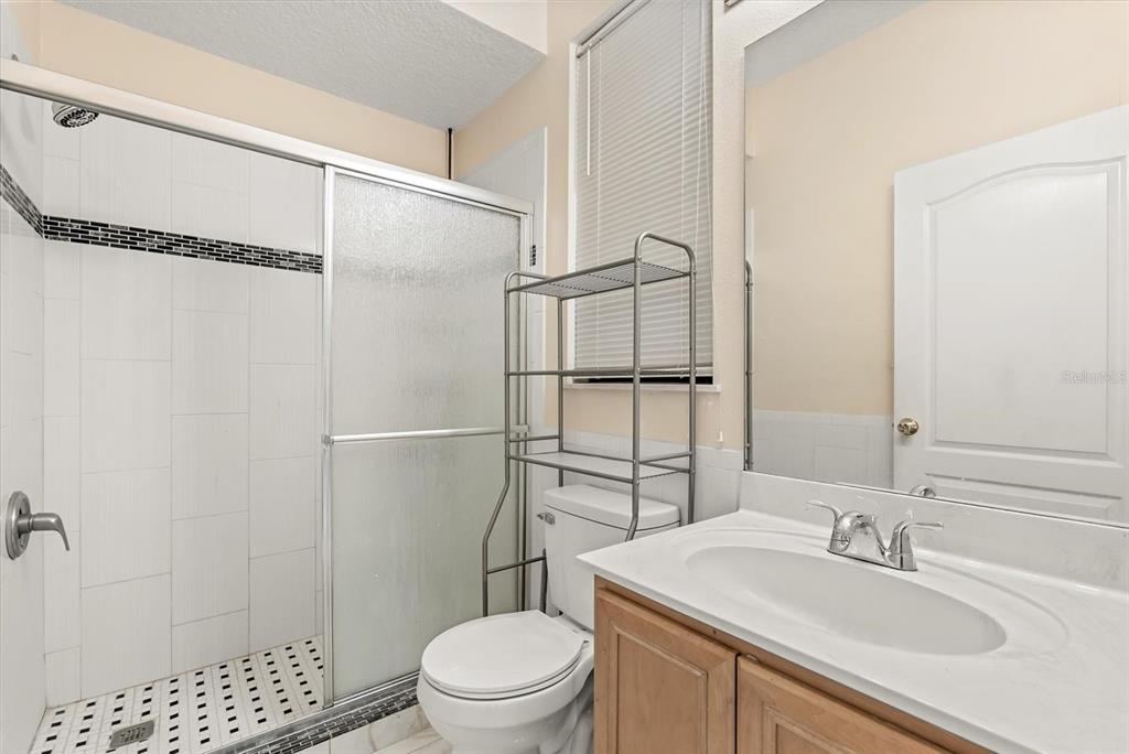 871 Blairmont Lane Lake Mary, FL 32746 - Photo 9 of 56 a bathroom with a sink toilet and shower