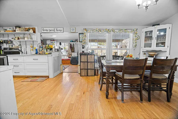 a view of a dining room with furniture window and wooden floor