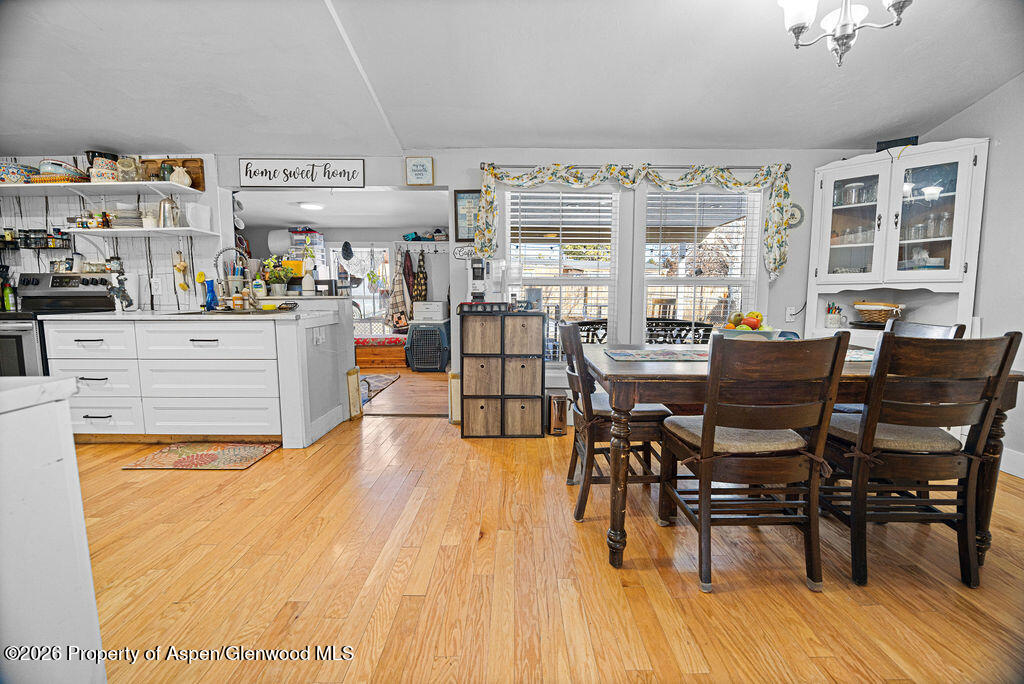 1464 Sage Street Craig, CO 81625 - Photo 11 of 47 a view of a dining room with furniture window and wooden floor
