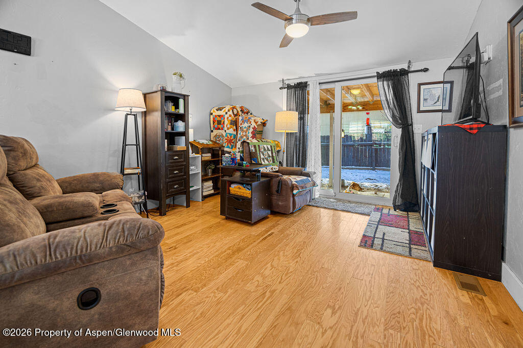 1464 Sage Street Craig, CO 81625 - Photo 13 of 47 a living room with furniture and a flat screen tv