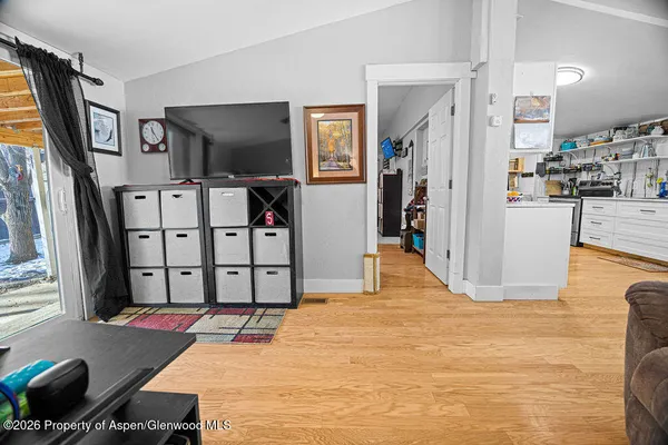 a living room with furniture window and flat screen tv