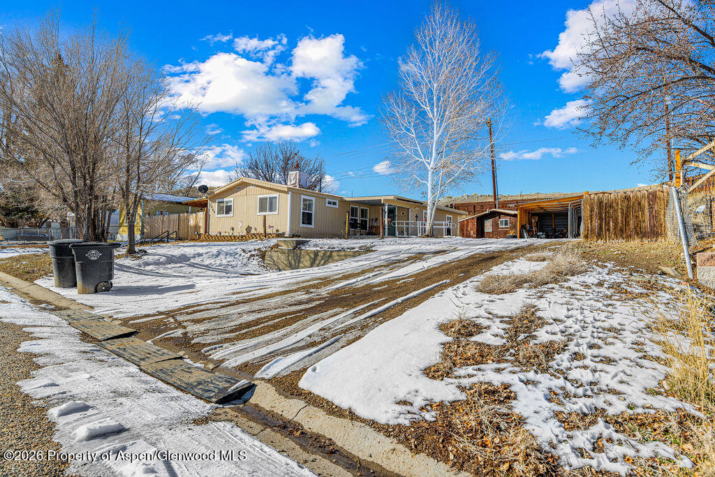 1464 Sage Street Craig, CO 81625 - Photo 2 of 47 a view of a street with a building on the road