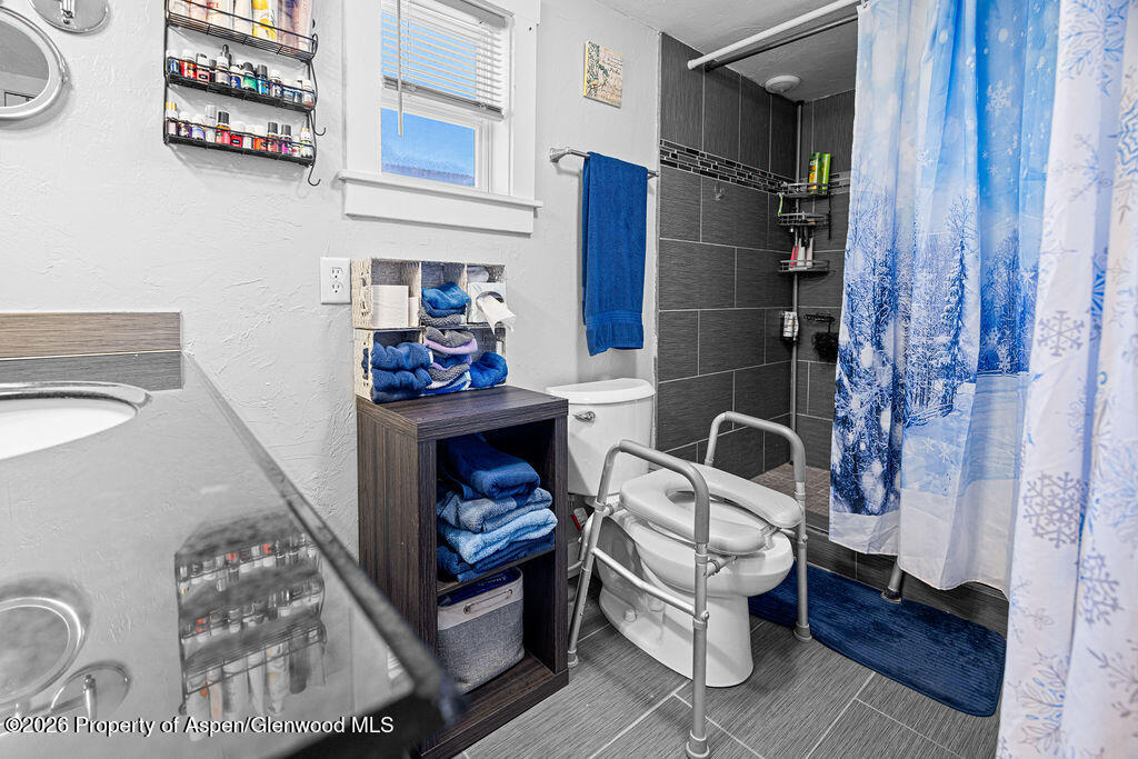 1464 Sage Street Craig, CO 81625 - Photo 22 of 47 a living room with furniture and a fireplace