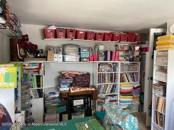 a outdoor living space with furniture and a book shelf
