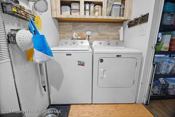 a utility room with dryer and washer